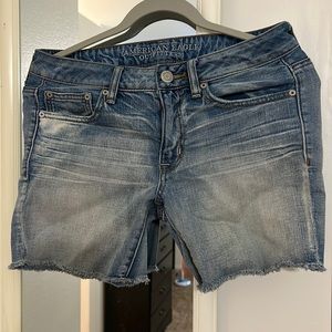 American Eagle “Boy Midi” light blue denim frayed shorts